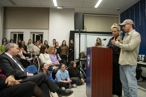 Rabbi Dr. Ari Berman, President of Yeshiva University (seated), listens to Karen Sharf Schem, Mia’s mother, and Ilay Schem, Mia’s brother, talk to YU students at Stern College for Women on March 12.